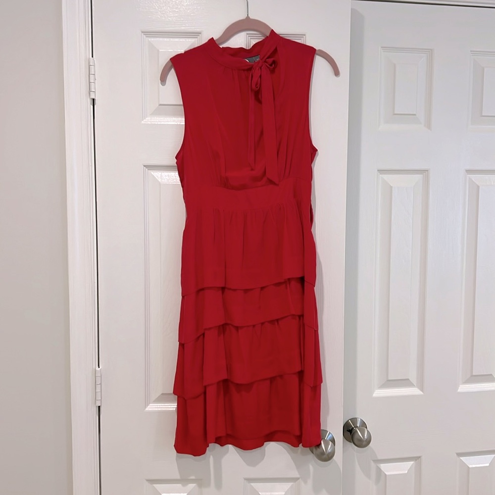 Adorable cocktail dress with bow at neck.